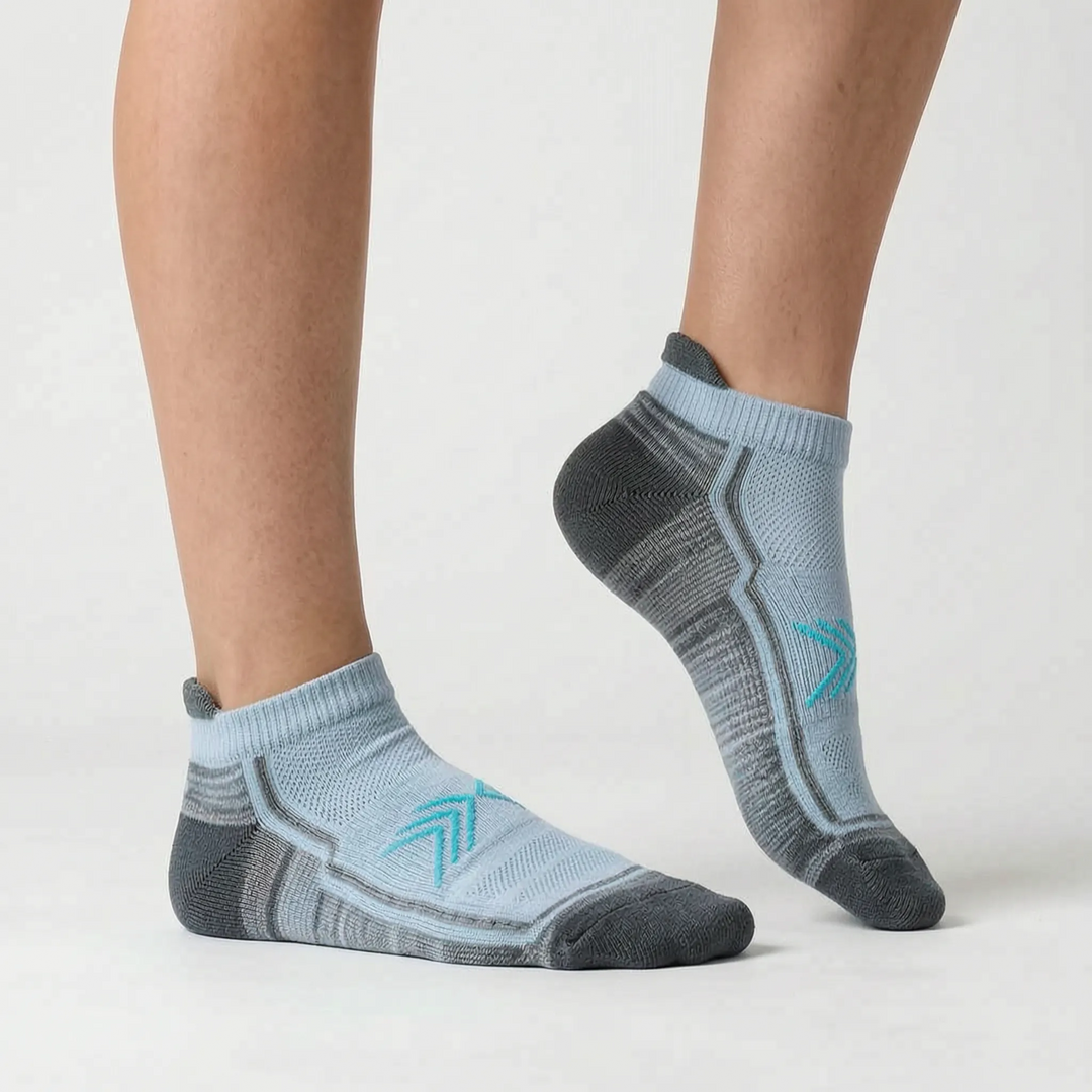 Performance green women's running socks. Non-slip, ankle-length, and moisture-wicking for workouts.