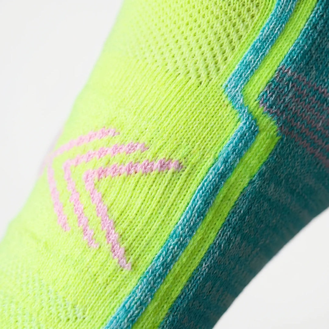 Moisture-wicking green athletic socks for women. Ankle-length non-slip design for comfort & support.
