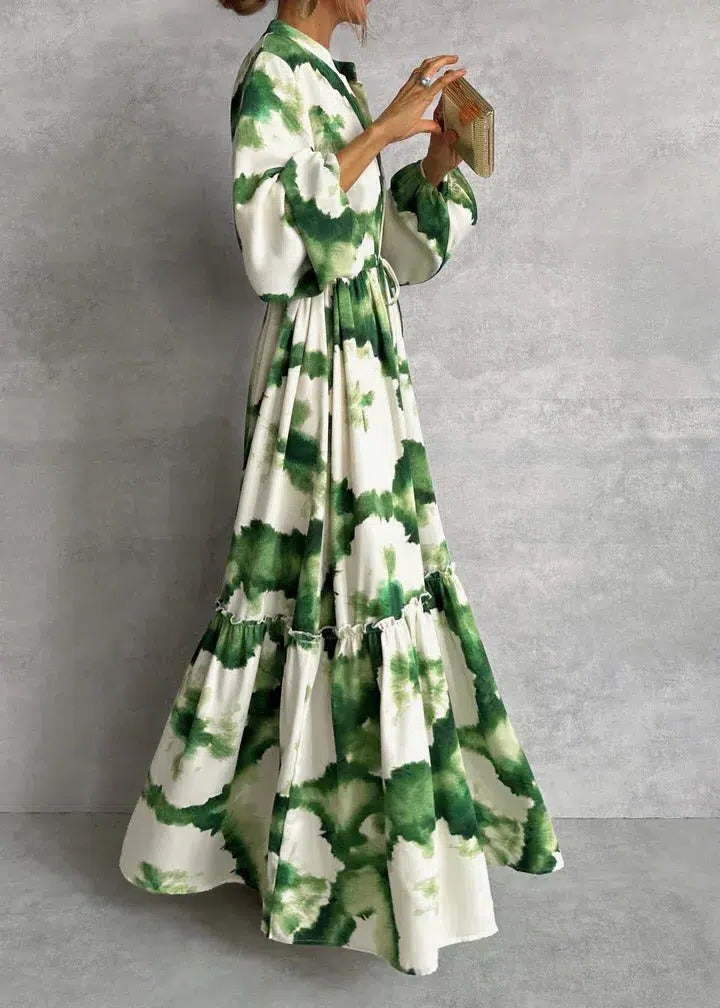 Flowy bohemian women's tie-dye maxi dress, long sleeve & tiered with a belt, ideal for spring/summer fashion.