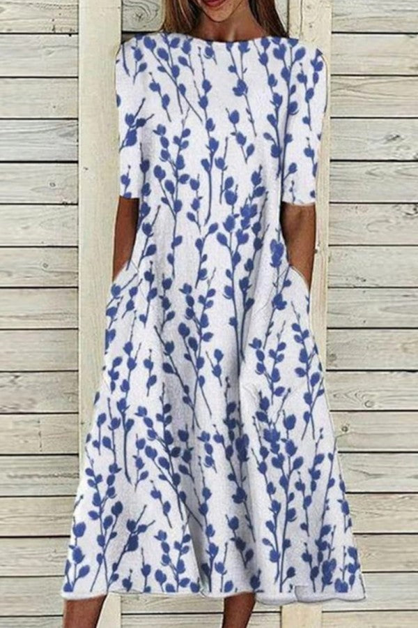 Women's half sleeve floral print crew neck casual dress. Comfortable, flowy design for summer & everyday wear.