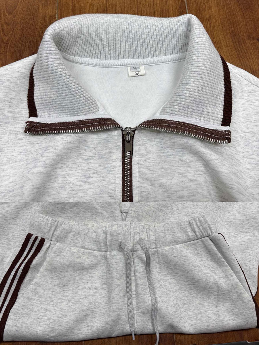 Modern women's two-piece co-ord set with a trendy half-zip top and chic wide-leg pants.