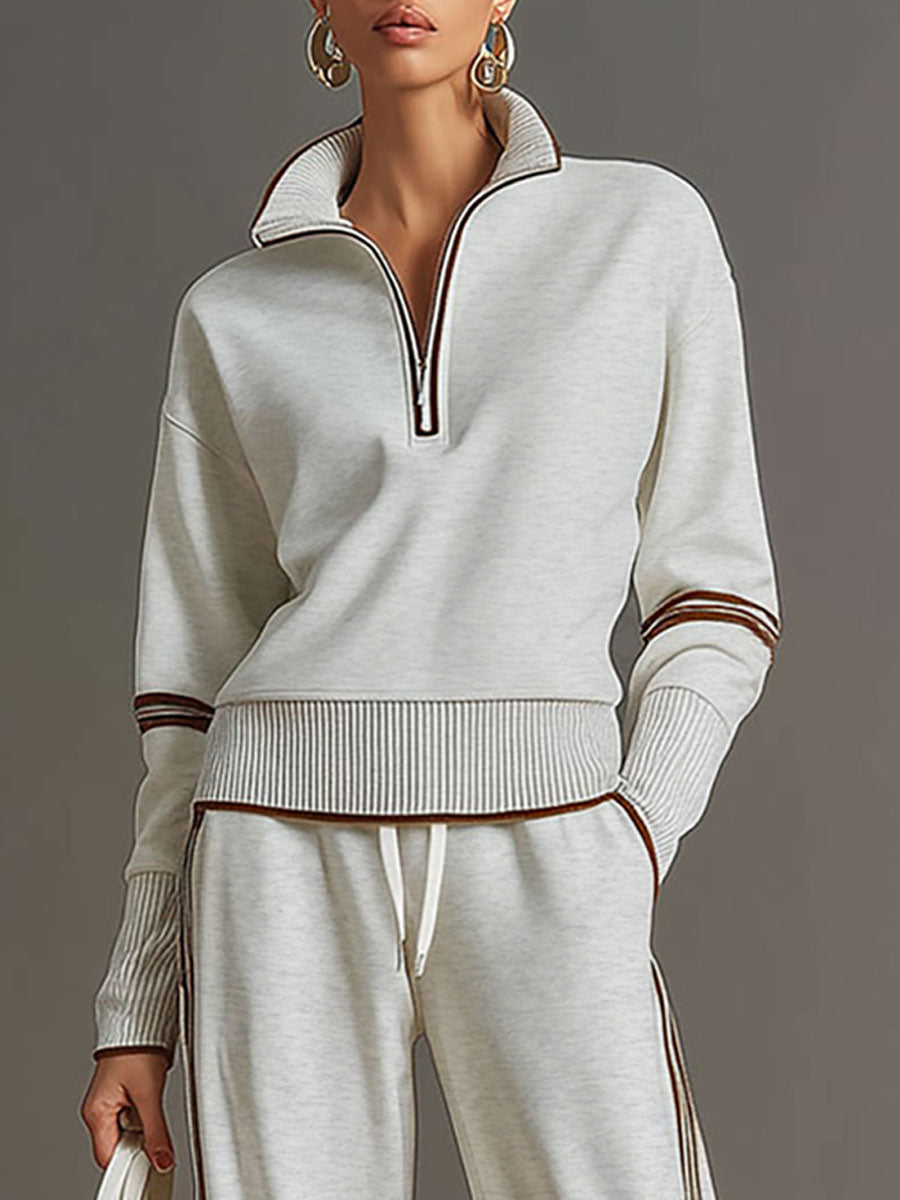 Full view of wide-leg trousers from a women's comfortable half-zip sweatshirt matching set.
