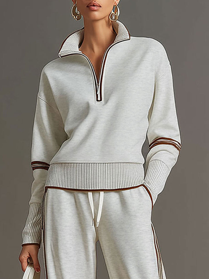Full view of wide-leg trousers from a women's comfortable half-zip sweatshirt matching set.
