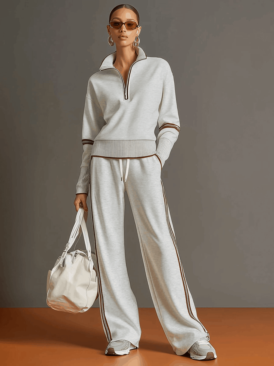 Stylish women's two-piece loungewear set: comfy half-zip sweatshirt and relaxed wide-leg trousers.