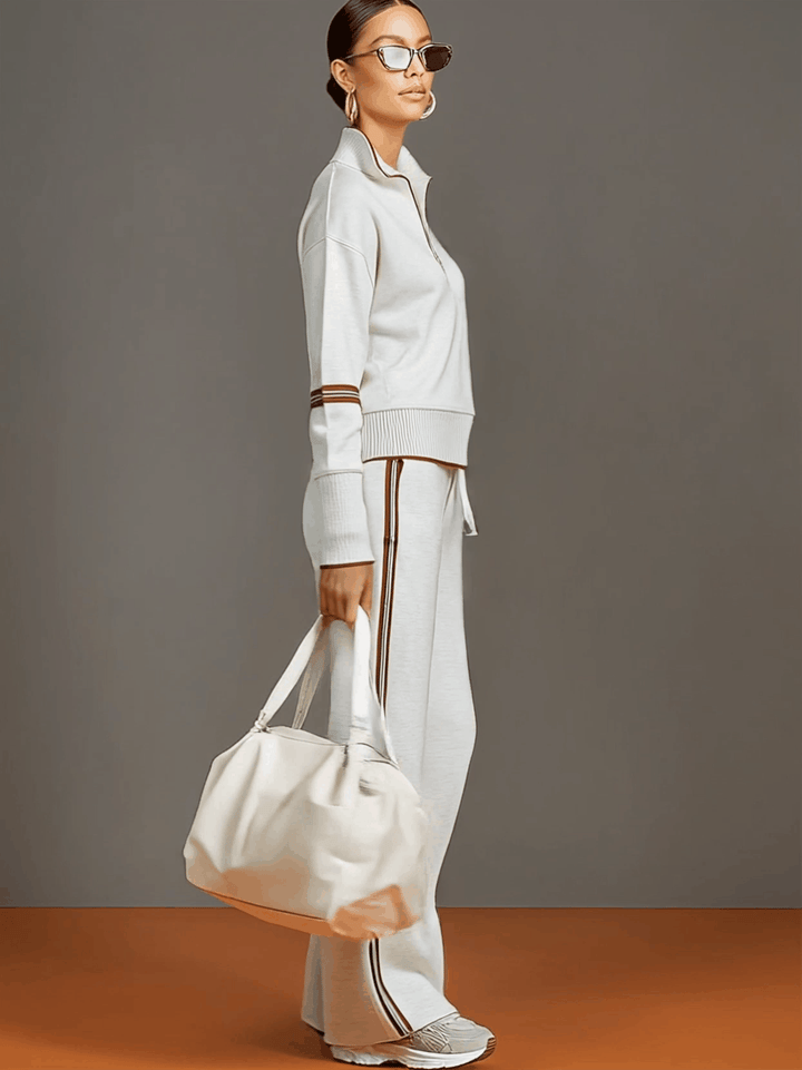 Casual women's co-ord set featuring a half-zip sweatshirt and flowy wide-leg trousers for everyday.