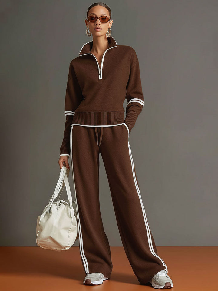 Woman in a relaxed half-zip sweatshirt & wide-leg trouser co-ord set, embodying comfortable style.