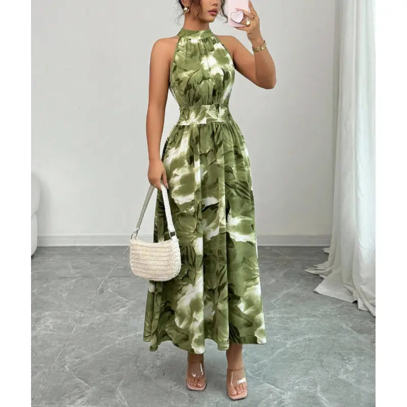 Women's halter neck maxi dress with a smocked waist, perfect for summer casual wear or elegant parties.