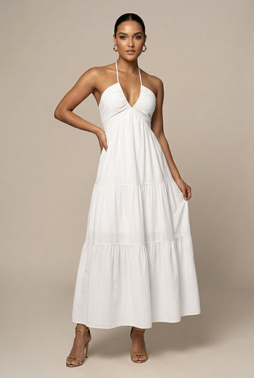 Summer-ready women's halter neck maxi dress with a graceful tiered ruffle skirt and open back.
