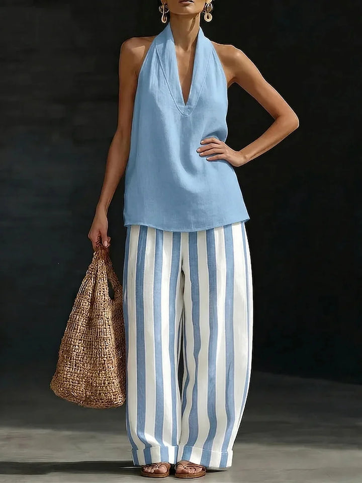 Women's halter top and wide-leg pant matching set. Comfortable, flowy two-piece outfit for summer resort wear.
