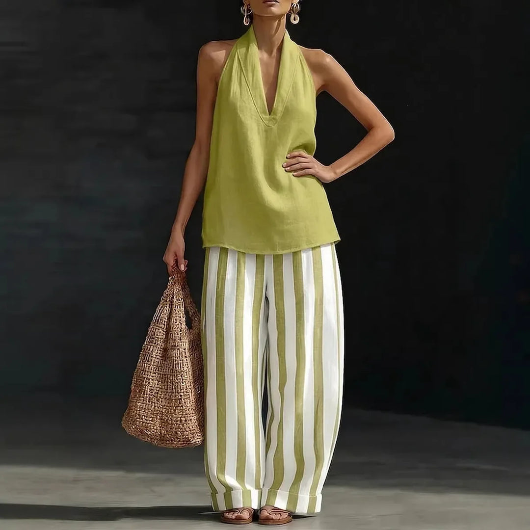 Elegant women's halter neck top with high-waist, wide-leg pants. Perfect casual or resort matching set.