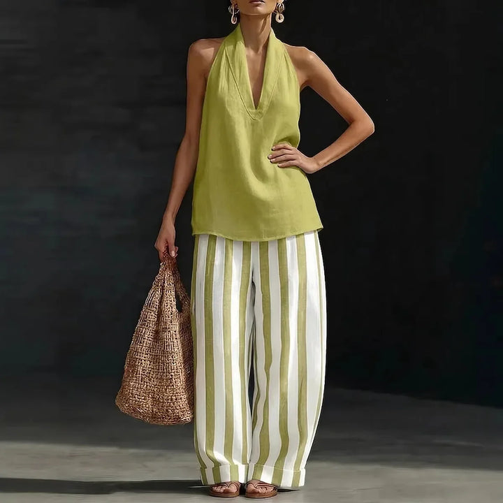 Elegant women's halter neck top with high-waist, wide-leg pants. Perfect casual or resort matching set.