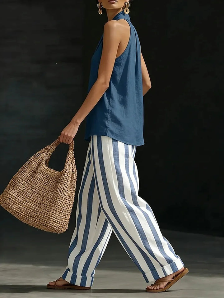 Comfortable women's two-piece matching set: flowy wide-leg pants & stylish halter top for summer casual wear.