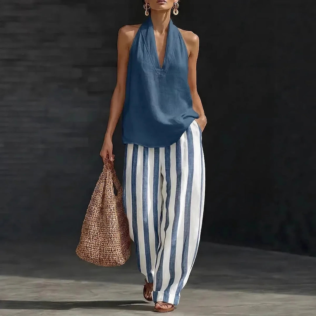 Flowy women's wide-leg pant and halter top set, an effortless two-piece outfit for relaxed summer style.
