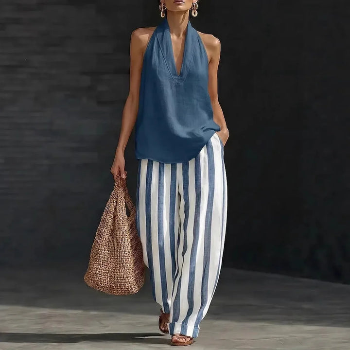 Flowy women's wide-leg pant and halter top set, an effortless two-piece outfit for relaxed summer style.