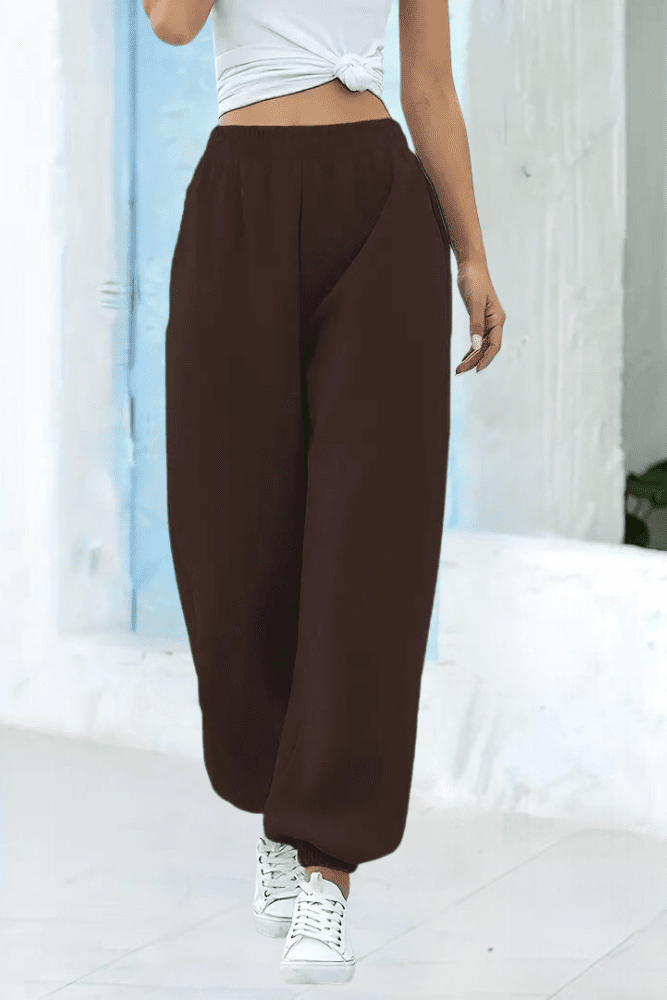 Relaxed fit women's high-rise joggers with an adjustable elastic waist for maximum comfort.