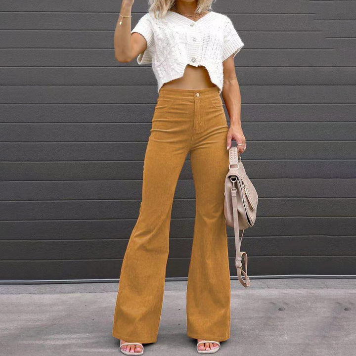 Elegant women's high-waist flared ribbed Kristin trousers, offering a flattering retro silhouette for fashion.