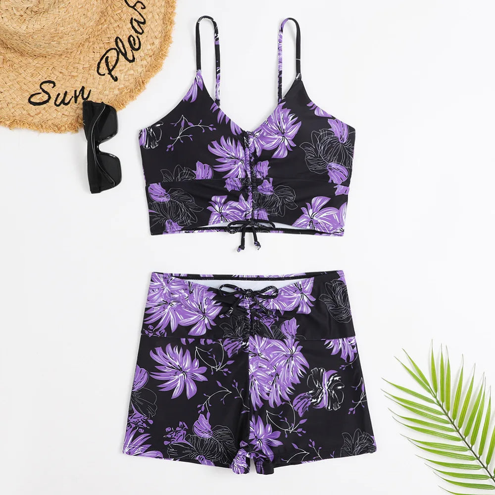Vibrant floral print high-waist bikini set, supportive women's swimwear for a sunny summer look.