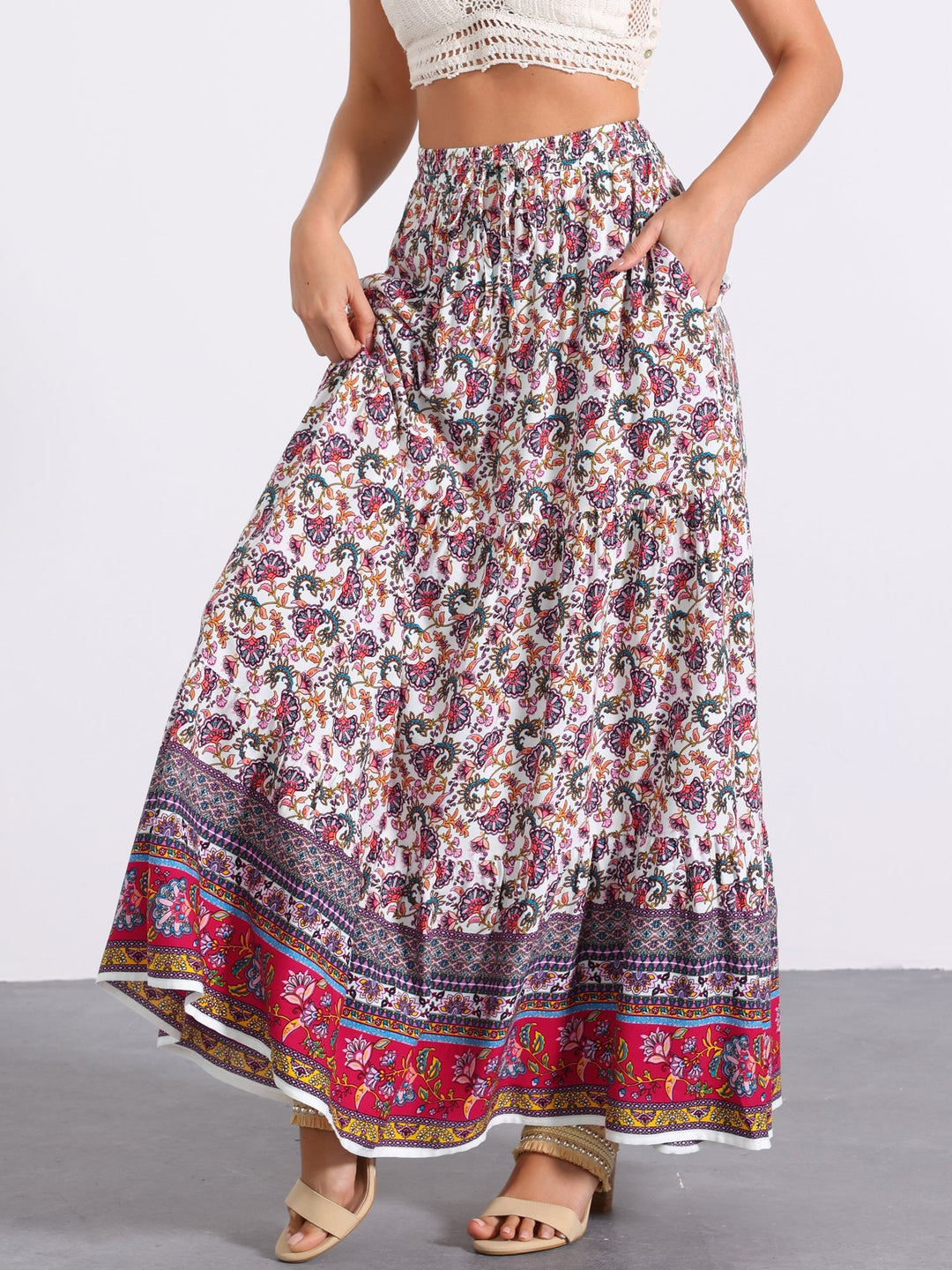 Chic women's high waist printed maxi skirt, flowing side slit for a stylish walk.