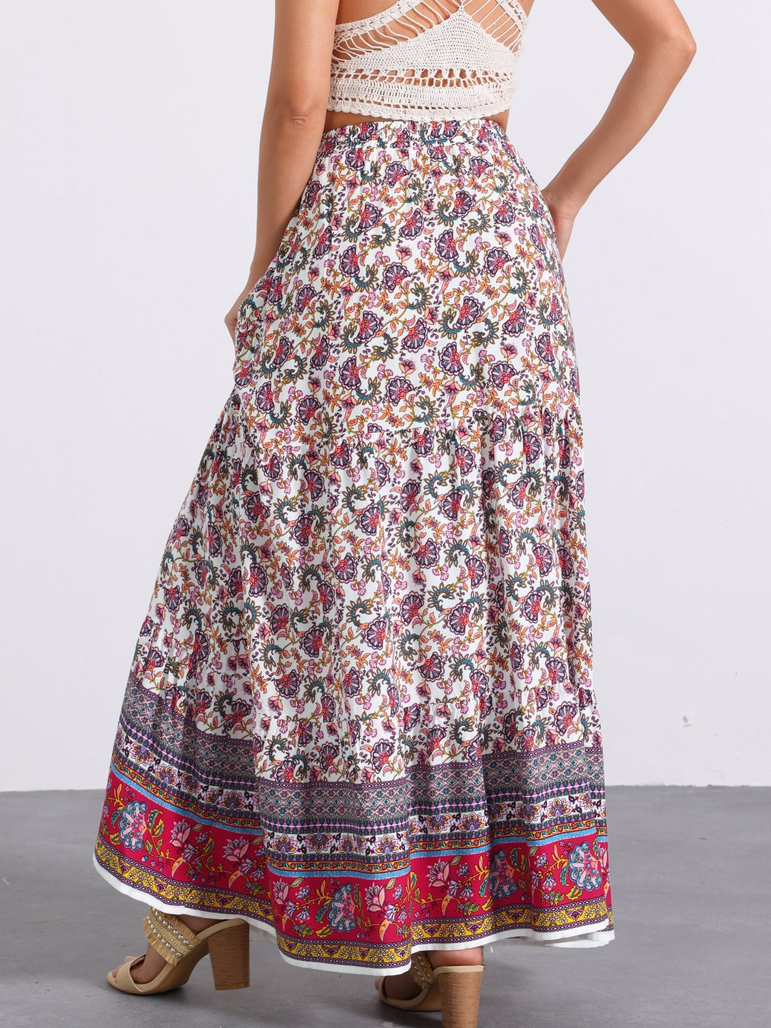 Vacation-ready high waist printed maxi skirt for women, flowing side slit for relaxation.
