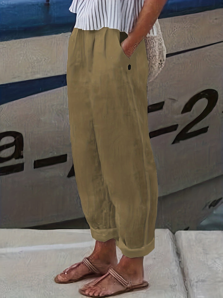 Comfortable women's high waist flowy pants, relaxed fit with stylish roll hem for effortless summer look.