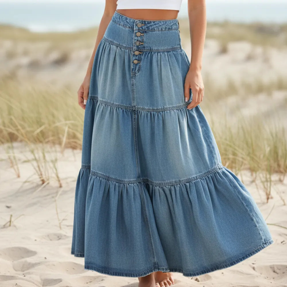 Women's high waist ruffled maxi skirt for festivals. Flowy bohemian A-line design, perfect for summer beach outfits.