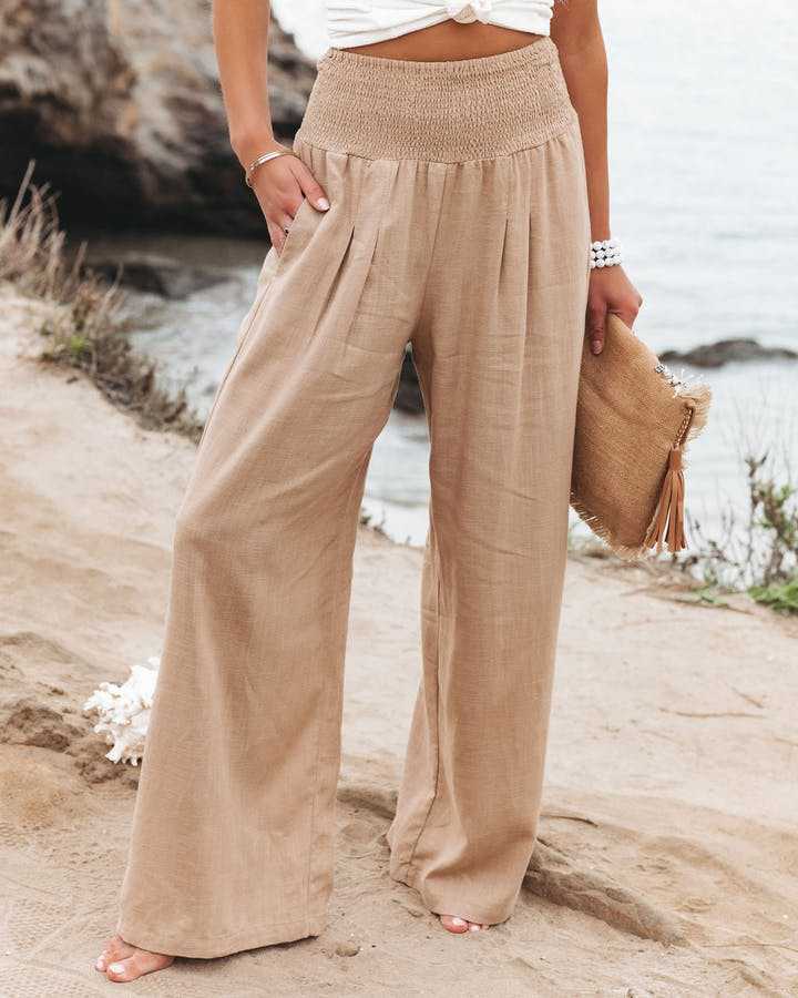 Women's high waist wide leg pants with smocked waistband in a relaxed fit, perfect for casual summer style.