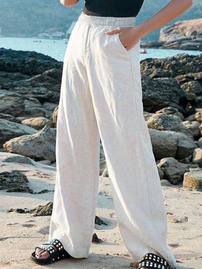 Chic women's wide leg high waist pants for resort wear, beach fashion, or elegant casual summer outfits. Flowing fit.