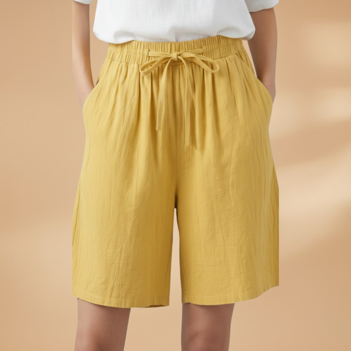 Casual women's wide leg shorts featuring a high waist and adjustable drawstring. Ideal for resort.