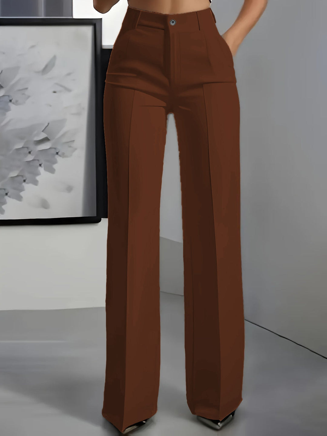 Woman wearing stylish high waist wide leg trousers, showcasing elegant drape & comfortable fit for fashion.