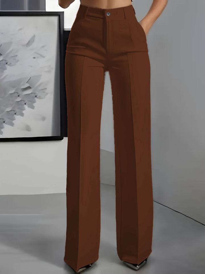 Woman wearing stylish high waist wide leg trousers, showcasing elegant drape & comfortable fit for fashion.