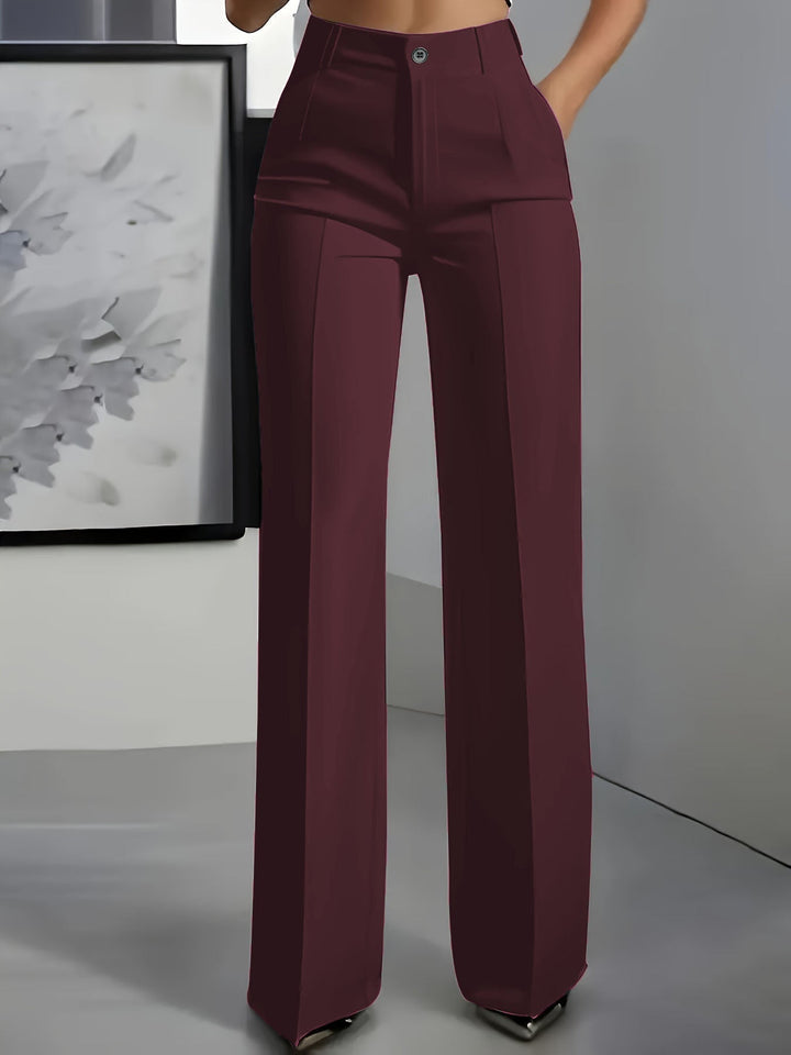 Close-up of structured fabric on women's high waist wide leg trousers, highlighting quality & texture.