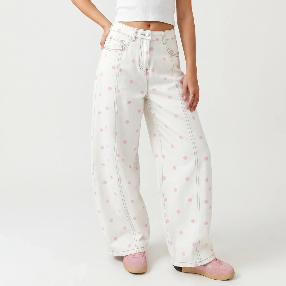 Stylish women's high-waisted barrel pants featuring a chic dotted print, perfect for casual spring fashion.