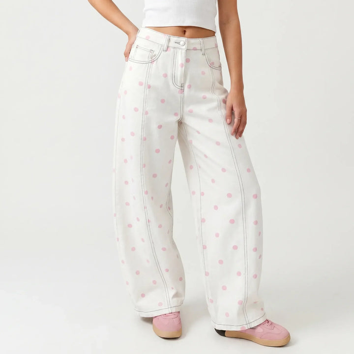 Stylish women's high-waisted barrel pants featuring a chic dotted print, perfect for casual spring fashion.