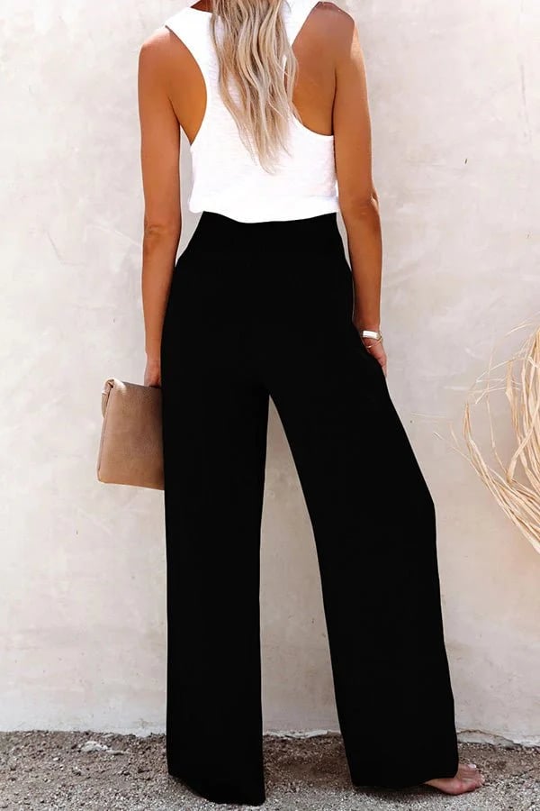 High-waisted tailored pants for women featuring a smocked back waist and chic button front detail.