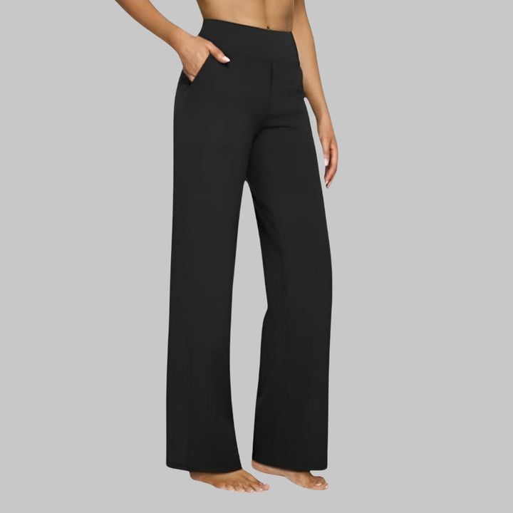 Modern women's high-waisted wide-leg trousers, featuring a comfortable flowy design and side pockets.