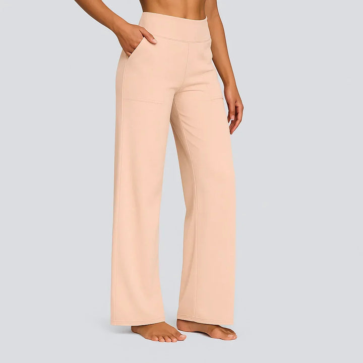 Women's high-waisted wide-leg trousers with side pockets, offering both comfort and a fashionable relaxed fit.