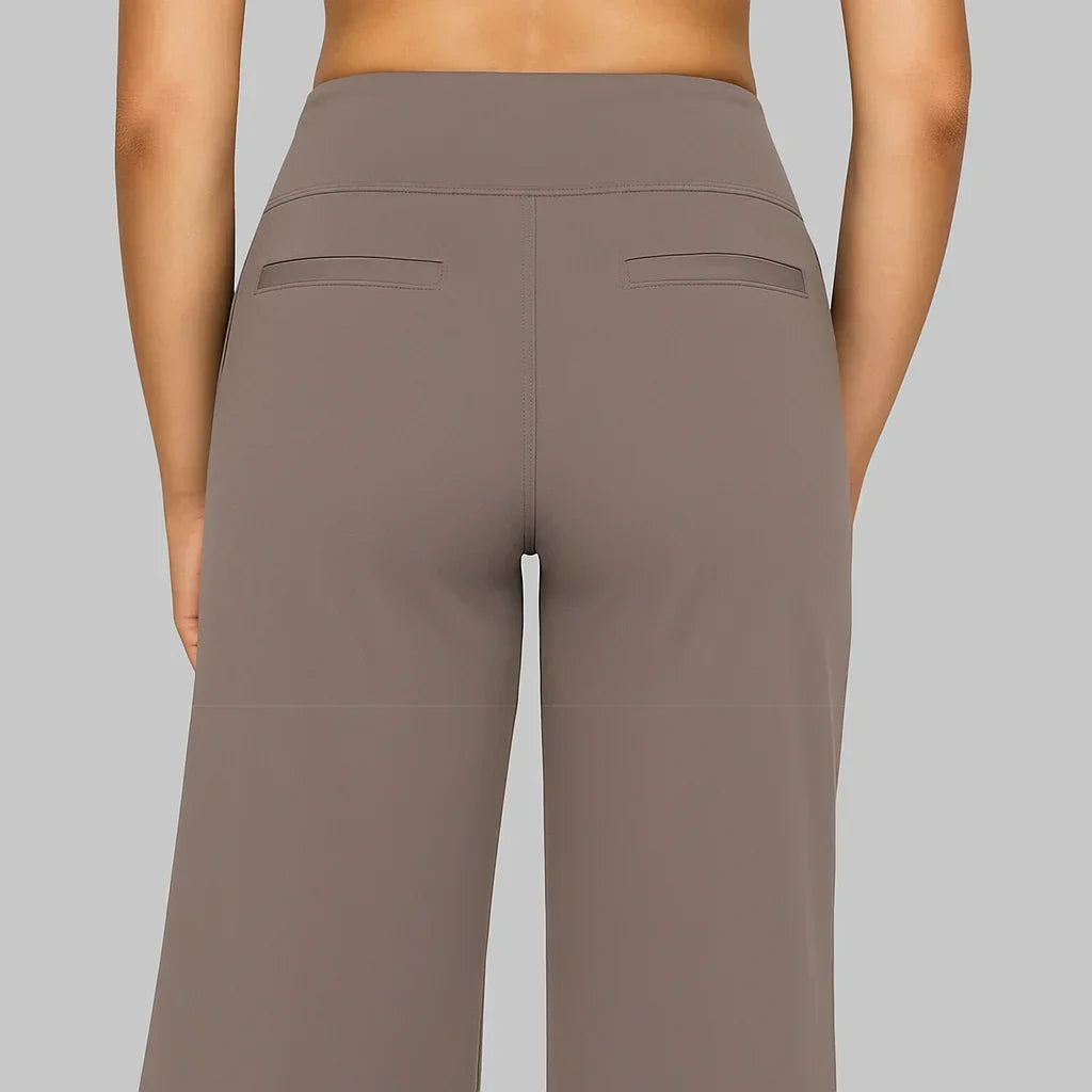 Versatile women's high-waisted pants with wide legs and convenient side pockets for relaxed wear.
