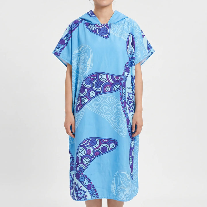 Comfortable women's hooded changing robe featuring a stylish tropical print, a post-swim vacation essential.