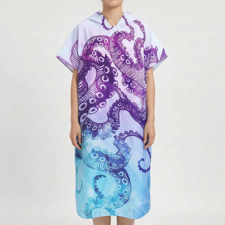 Surf poncho for women, a quick-dry hooded changing towel with a vibrant tropical design for beach and water.
