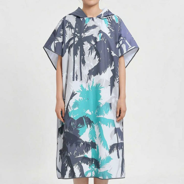 Vacation essential: an oversized women's changing robe, a quick-dry hooded tropical print beach poncho for ease.