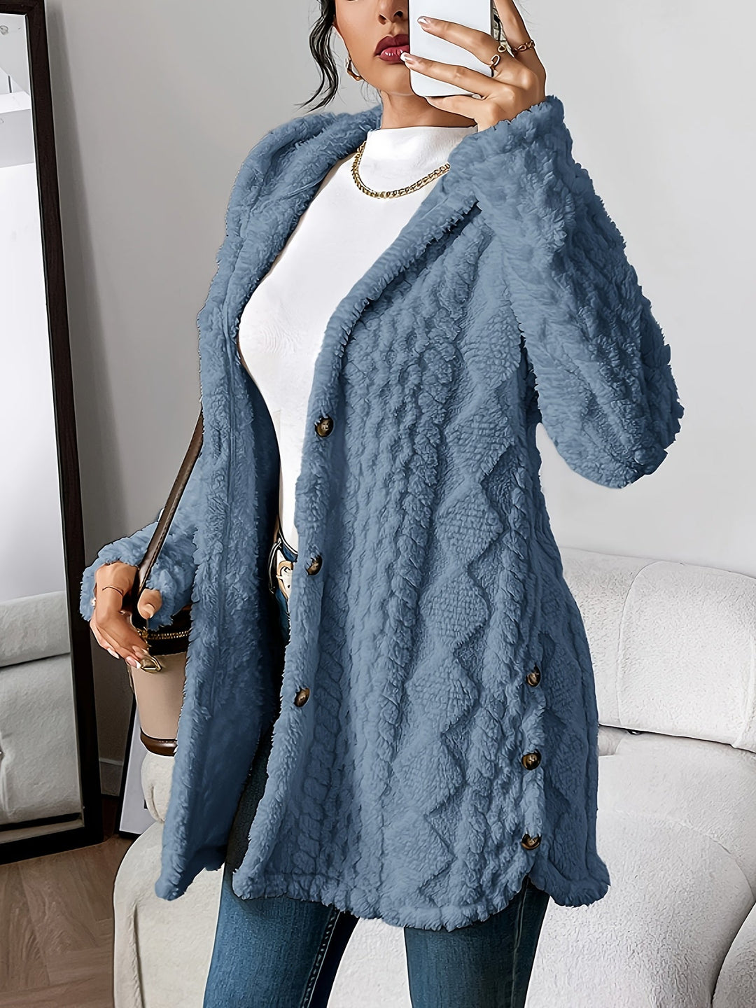 Casual women's hooded long coat with distinctive button detail, ideal for everyday outerwear.
