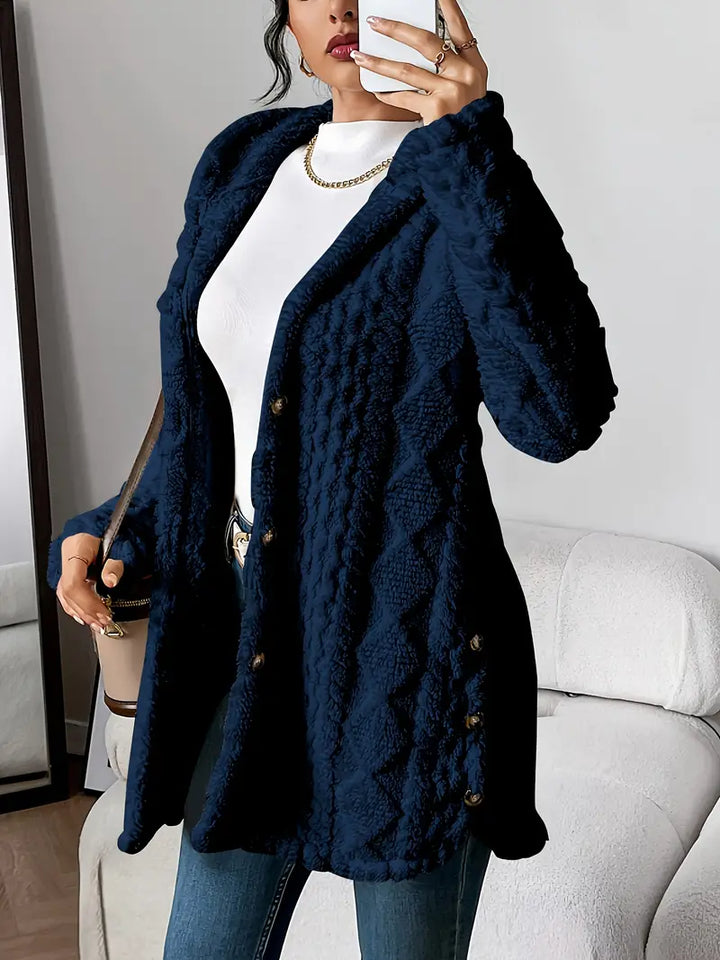 Cozy women's long hooded outerwear, featuring a full button-down front for warmth.