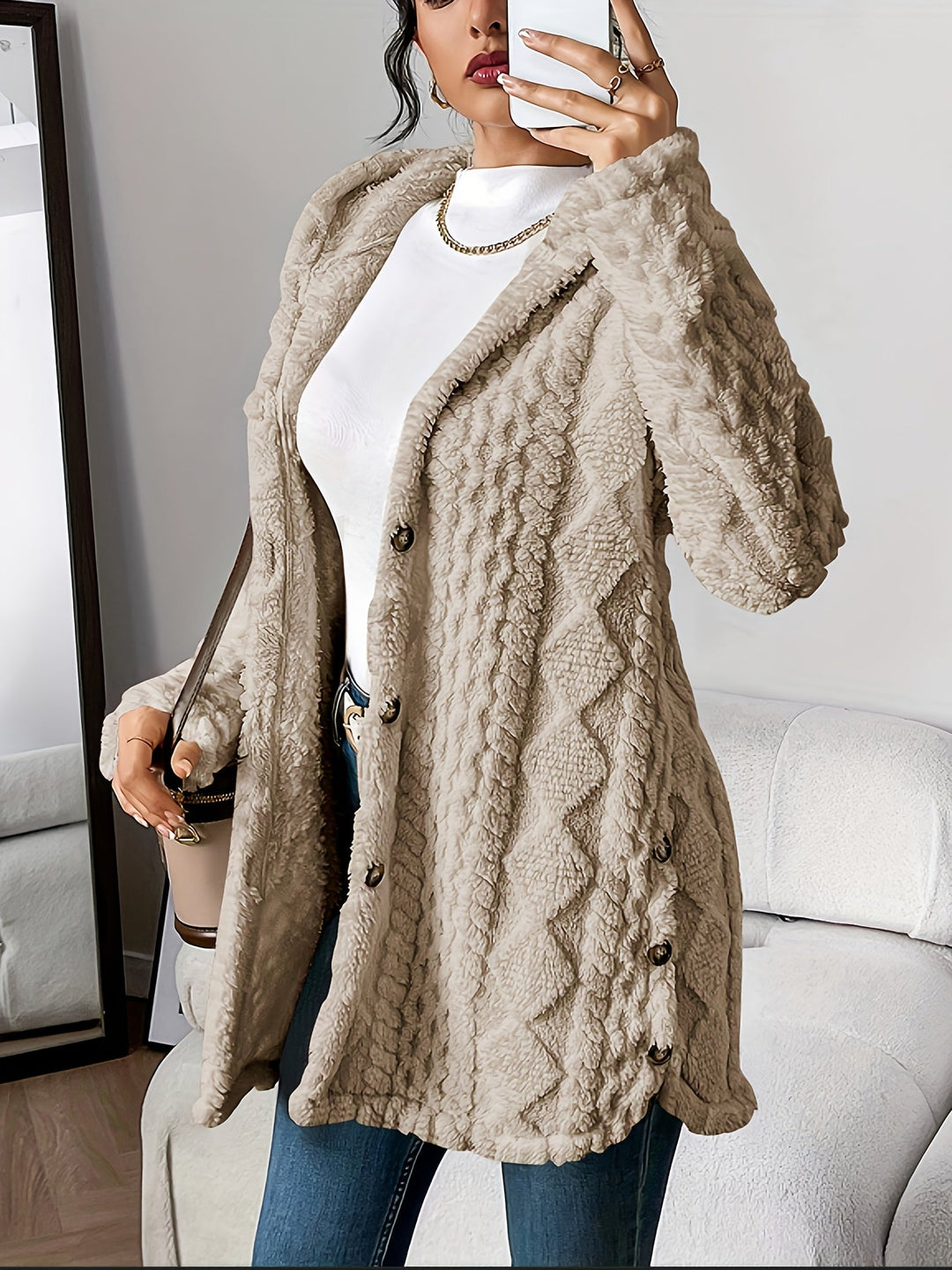 Chic women's hooded long jacket, button-front design for a stylish fall and winter look.