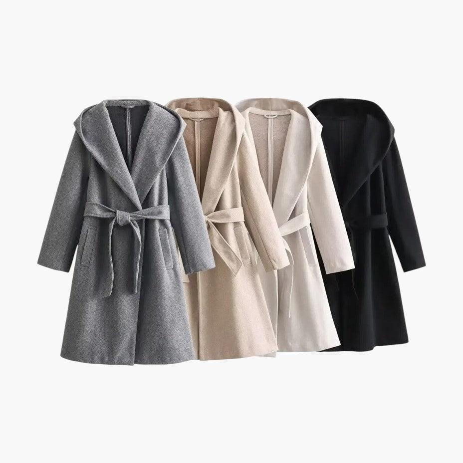 Full-length view of a women's classic hooded trench coat, elegant & belted for a chic look.