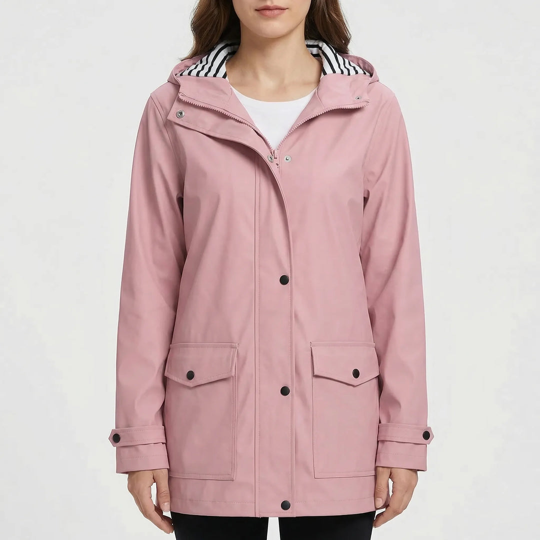 Close-up of women's waterproof rain jacket fabric. Hooded, lightweight outdoor gear for hiking.