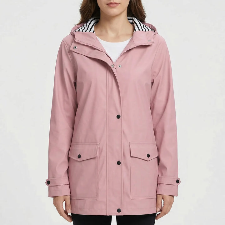 Close-up of women's waterproof rain jacket fabric. Hooded, lightweight outdoor gear for hiking.
