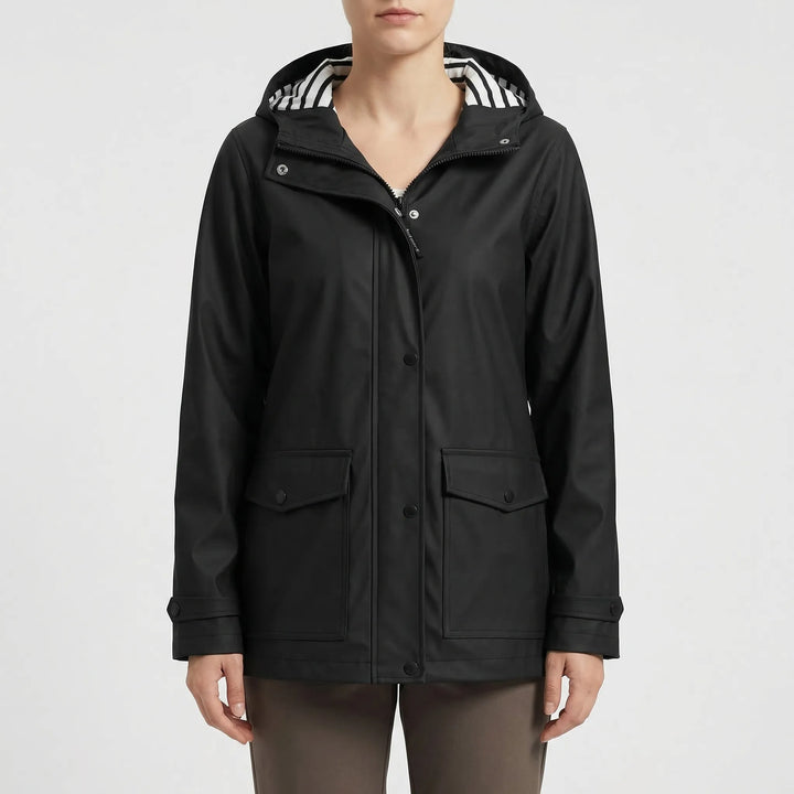 Durable women's waterproof hooded rain jacket. Lightweight, longline design for hiking & travel.