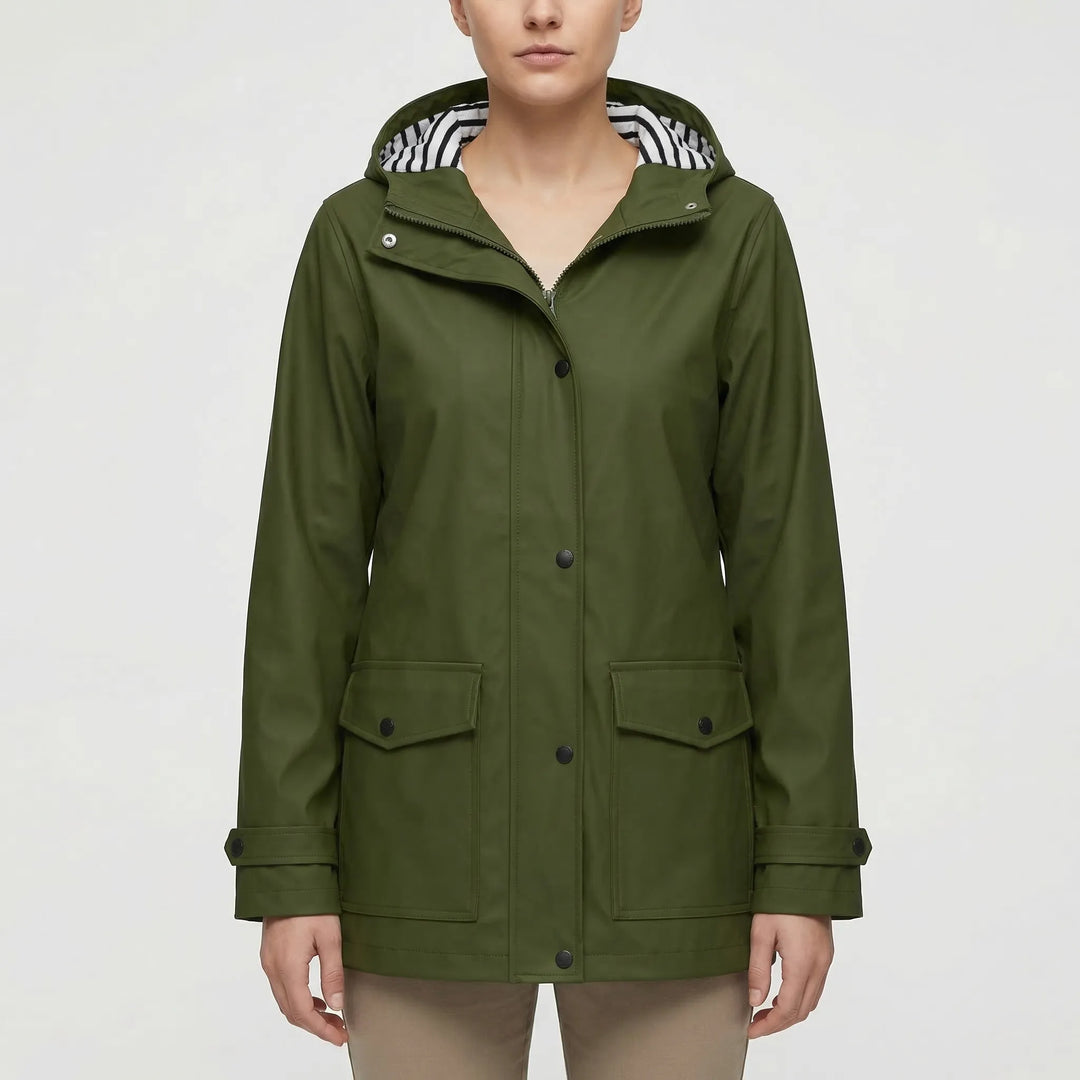 Lightweight women's hooded waterproof jacket. Packable rain gear for hiking & adventure travel.