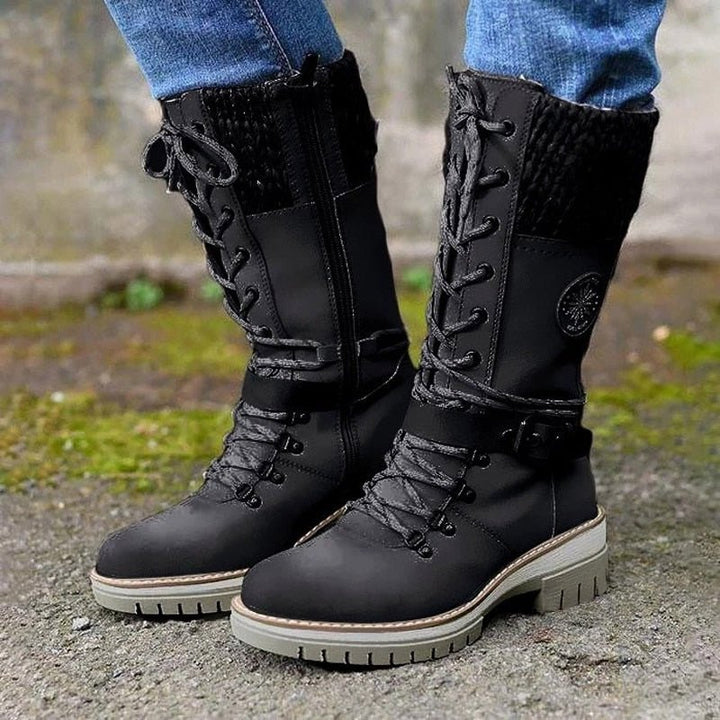 Warm women's insulated snow boots. Ideal for harsh winter conditions, ensuring cozy comfort & secure footing.