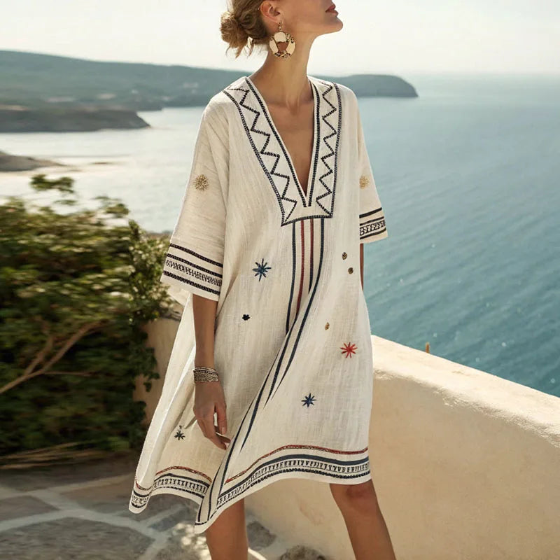 Women's kimono beach cover-up dress with delicate embroidery & stylish V-neck for summer vacations.